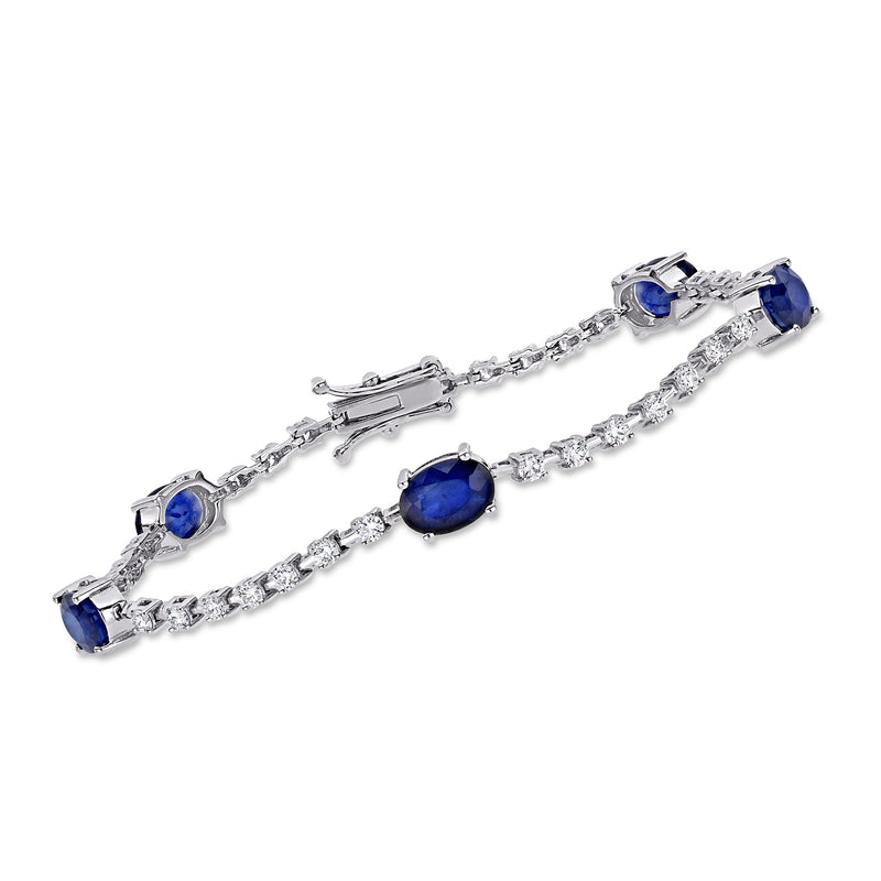 18kt white gold tennis bracelet with oval blue sapphire stations and diamond accents