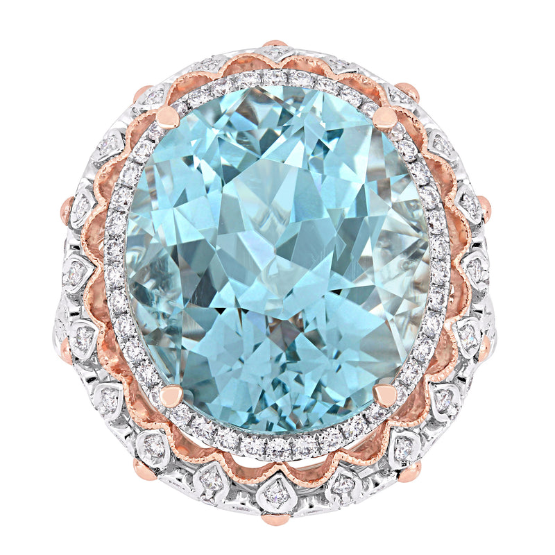 Two-tone gold cocktail ring with oval sky-blue topaz and diamond halo, prong set