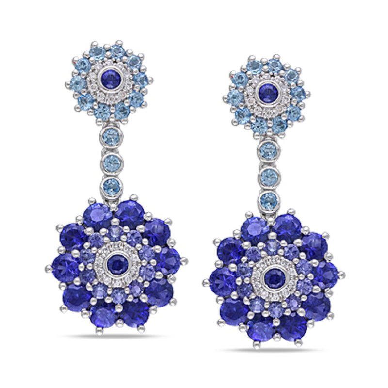 White gold drop earrings with blue gemstone clusters and round sapphire accents