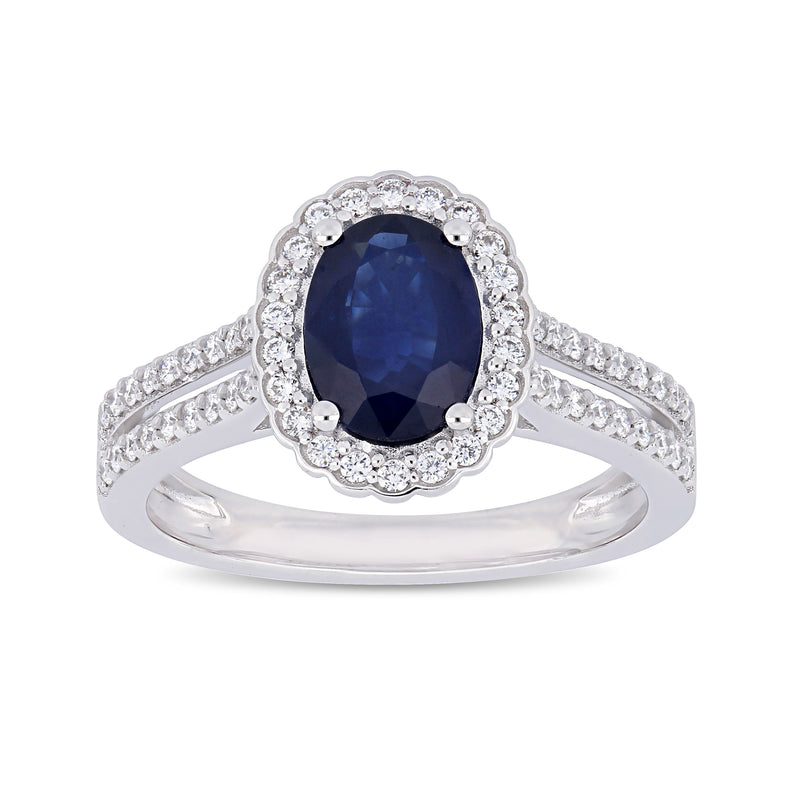 14kt white gold halo ring with oval dark blue sapphire and round diamond accents