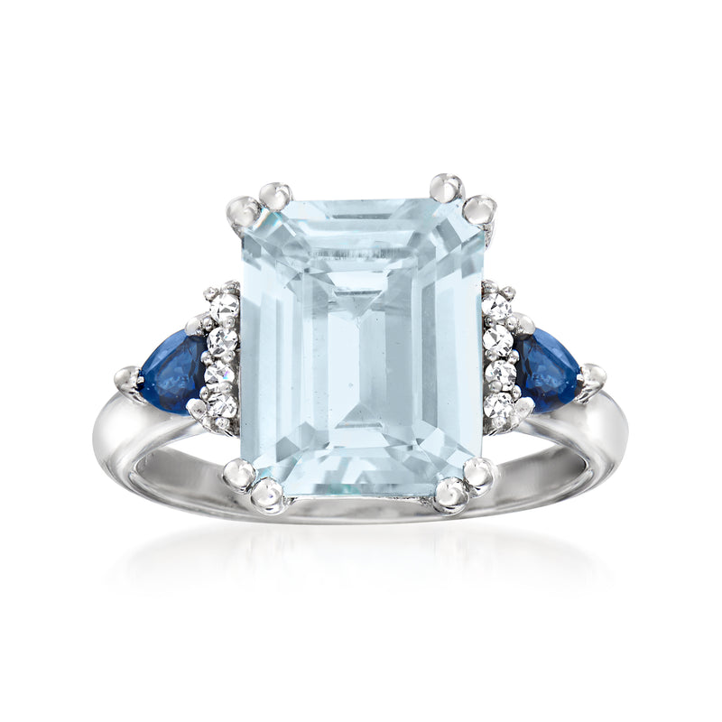 Sterling silver ring with rectangular aquamarine, diamond halo, and blue sapphire accents