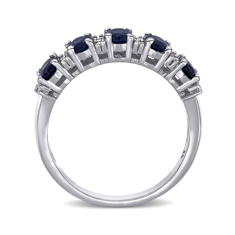 Sapphire and diamond ring in 14kt white gold with blue oval stones in prong-set rows