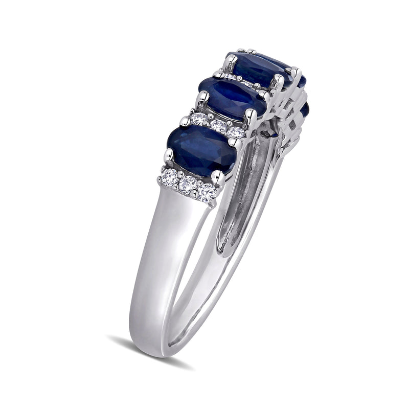 Sapphire and diamond ring in 14kt white gold with three blue oval sapphires and diamond accents