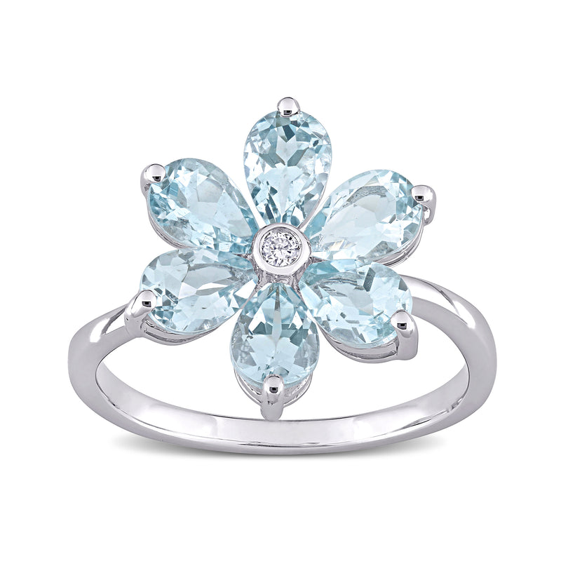 14kt white gold flower ring with oval aquamarines and a round diamond center