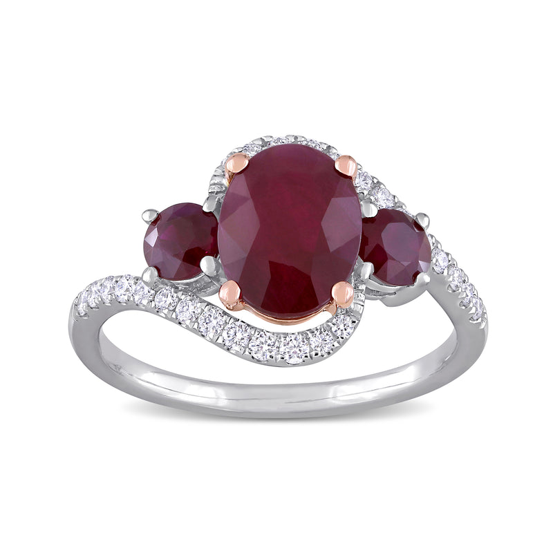 Two-tone gold ring with oval red ruby center and white diamond halo