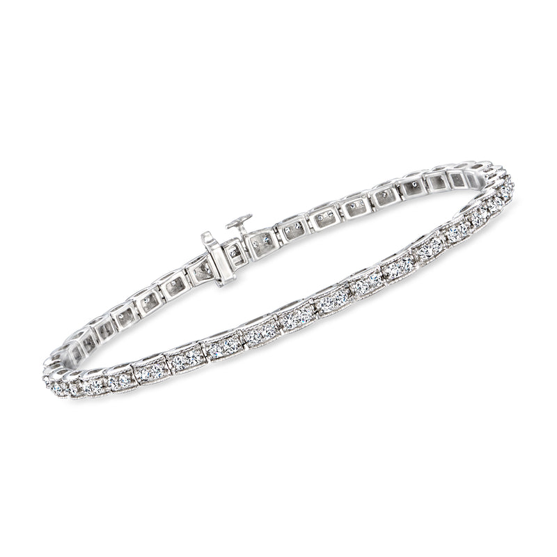 14kt white gold diamond tennis bracelet with milgrain detailing and row of baguette stones