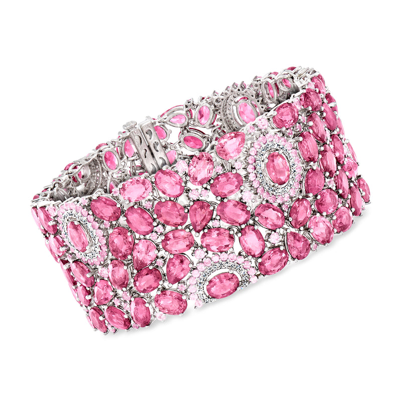 Pink gemstone and diamond bracelet in white gold, oval and round stones in a cluster design.