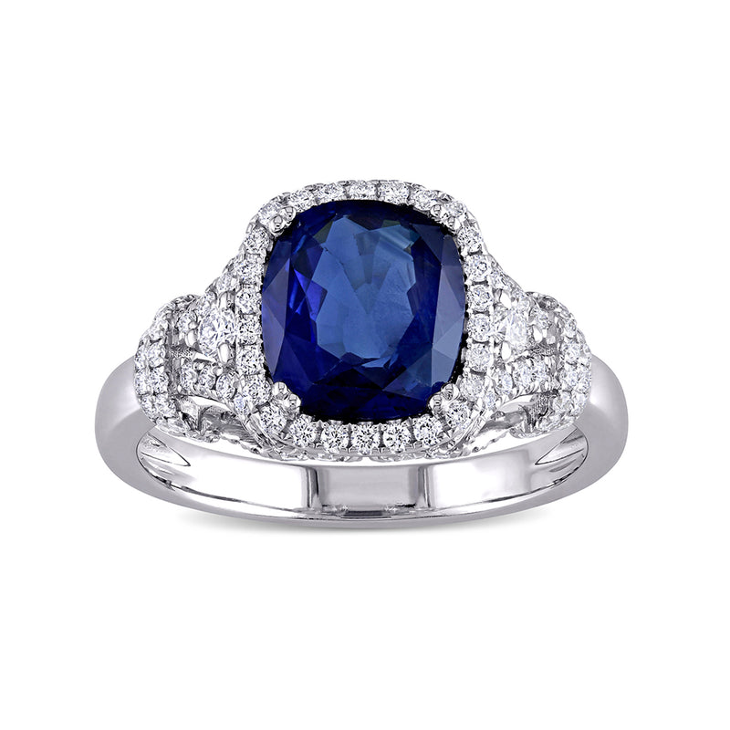 Blue sapphire halo ring with diamond accents, 14k white gold band