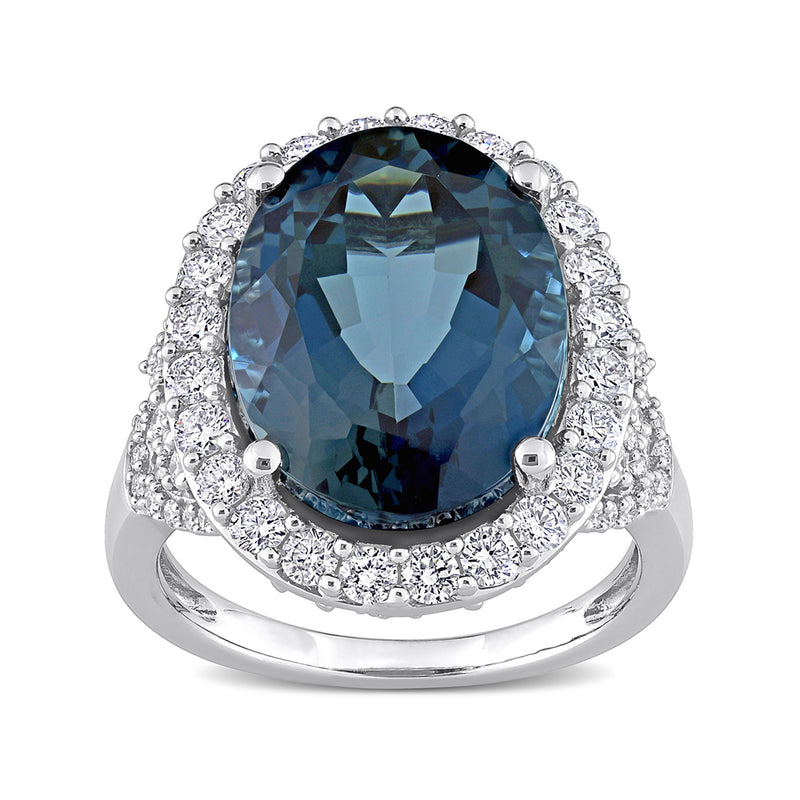Oval blue topaz ring with diamond halo and 14kt white gold band