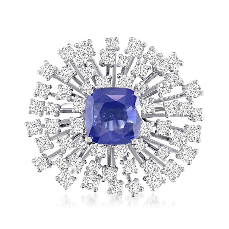 Blue sapphire center with diamond halo and prong-set accents on white gold ring