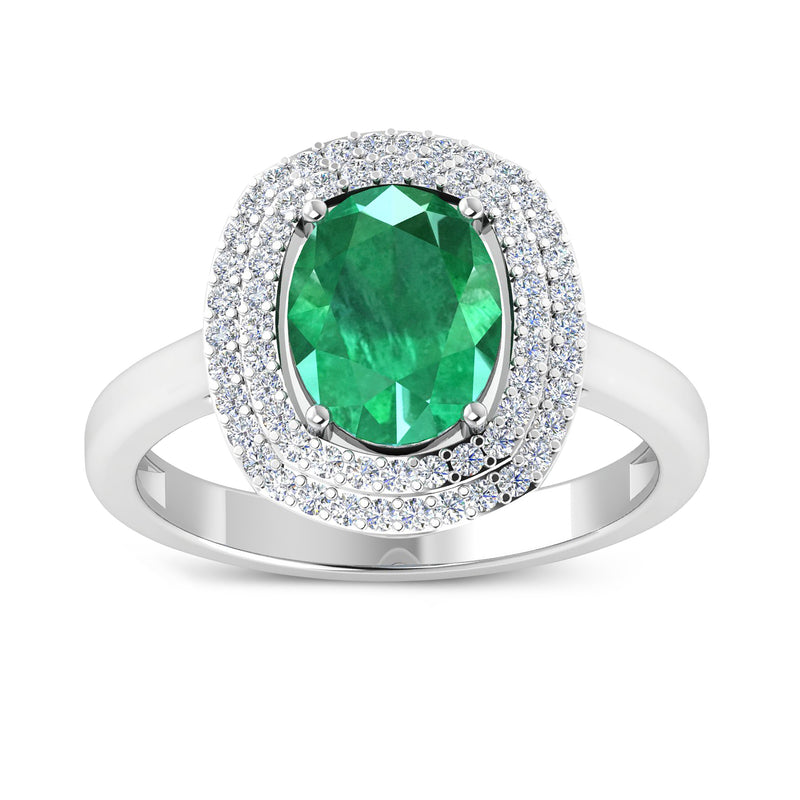 White gold ring with oval green emerald halo and diamond accents