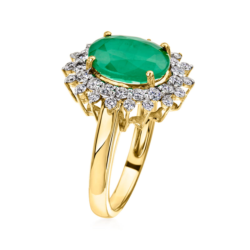 Yellow gold ring with oval green center stone and diamond cluster underband