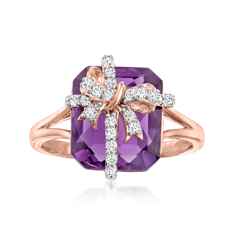 Rose gold bow ring with dark purple amethyst-like gemstone and white topaz accents