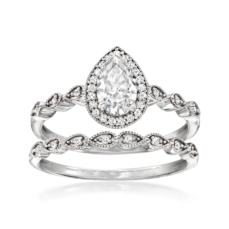 Moissanite bridal set with pear-cut halo engagement ring and matching band in sterling silver