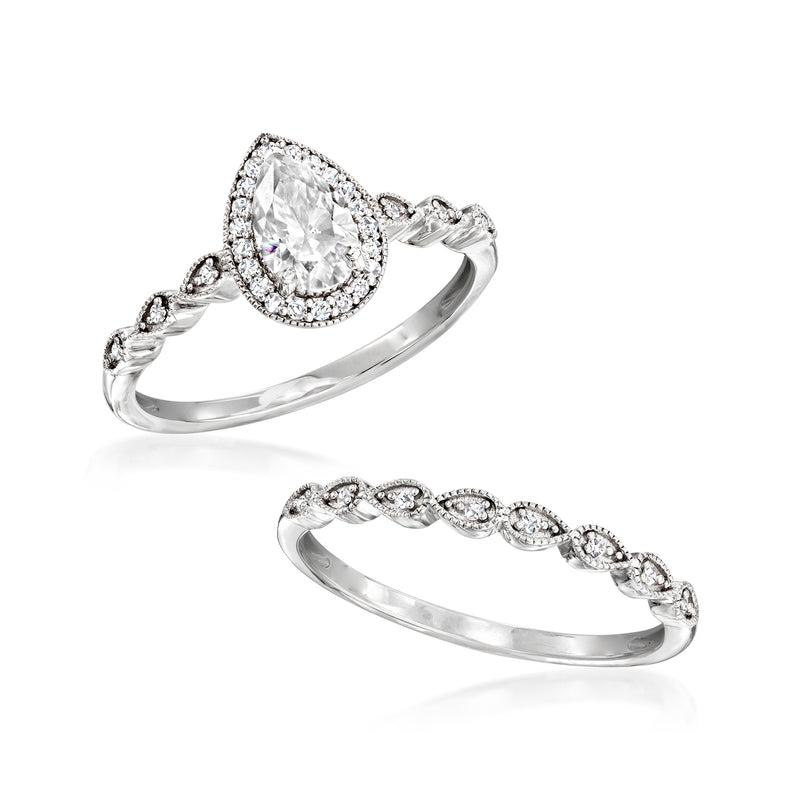 Sterling silver moissanite bridal set with pear-cut halo ring and matching band