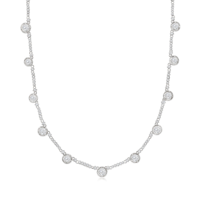 Platinum station necklace with bezel-set round diamonds along a fine chain