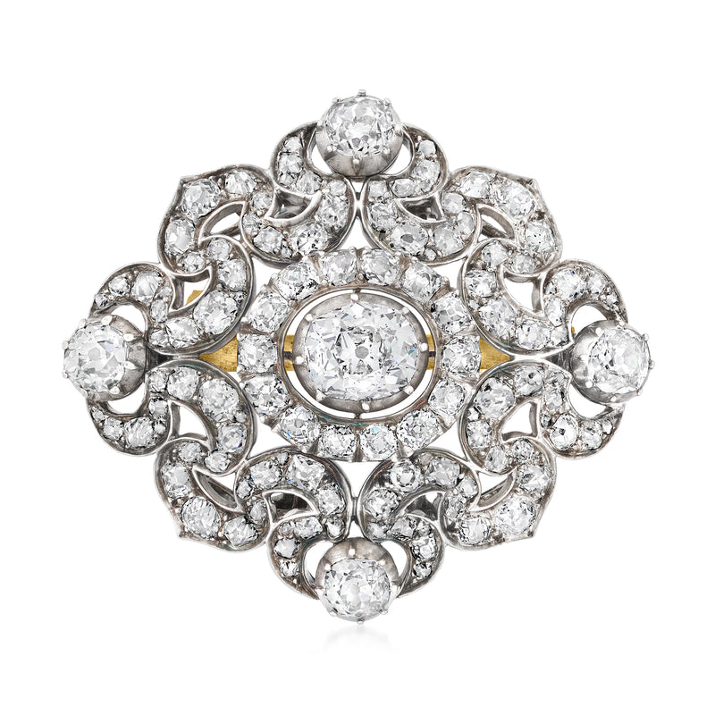 Vintage diamond cluster pin with round stones, yellow gold accents and silver setting