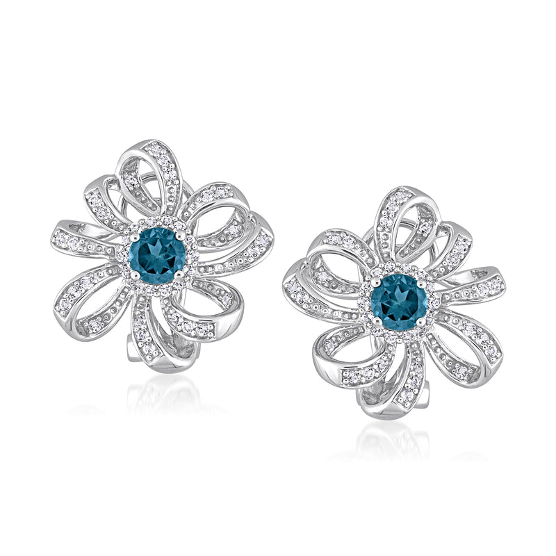 Sterling silver flower stud earrings with blue and clear gemstone centers, post backs