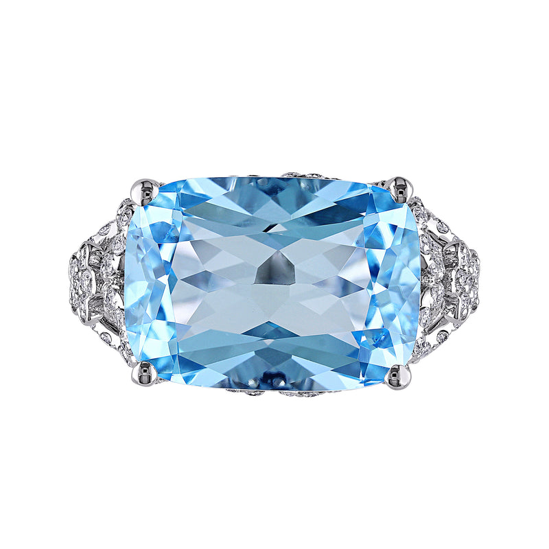 14kt white gold ring with large rectangular sky blue topaz and diamond side details