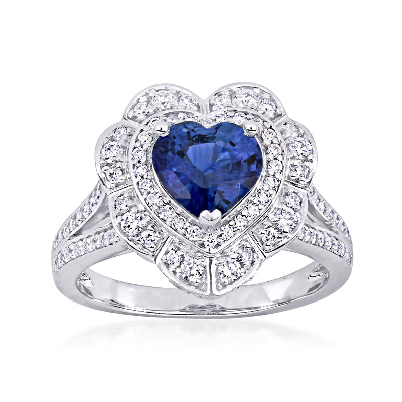 Heart-shaped blue sapphire ring in white gold with diamond halo and side accents