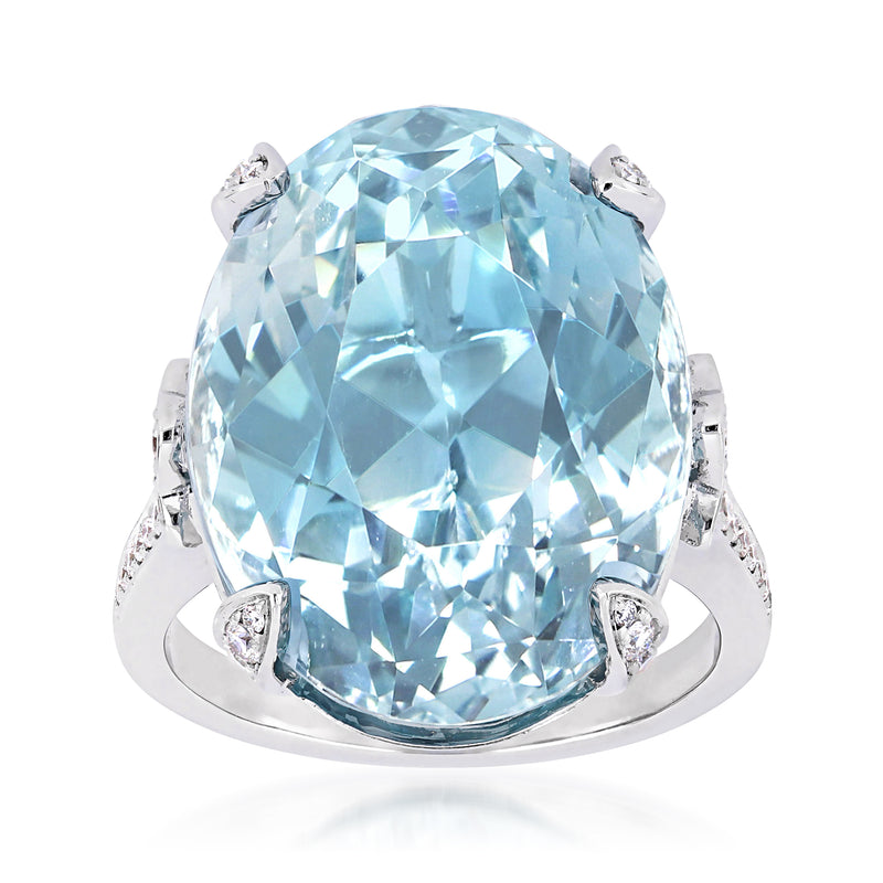 Sky blue topaz and diamond ring in 14kt white gold, oval center with side stones