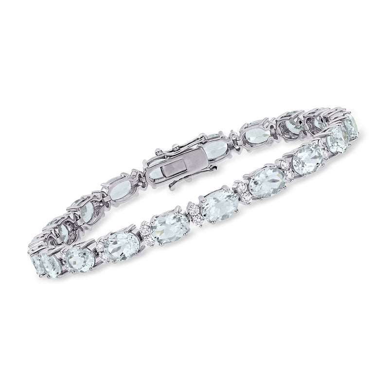 18kt white gold tennis bracelet with oval aquamarine gemstones and diamond accents