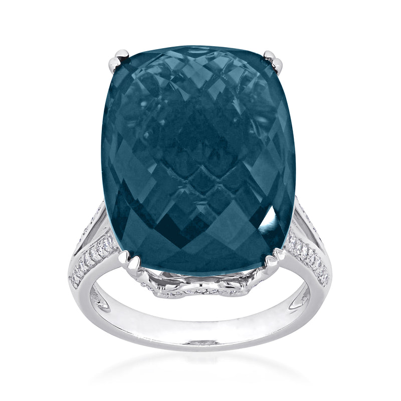 London blue topaz ring with oval faceted gemstone, prong setting, diamond accents in white gold