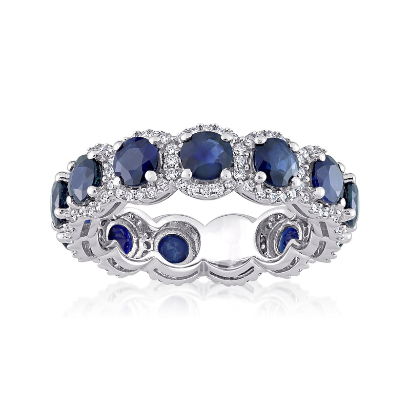 14kt white gold eternity band with dark blue oval sapphires and diamond halos