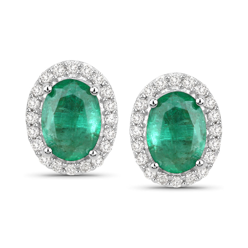 Emerald-cut green stud earrings with diamond halo, 14kt white gold post backs.