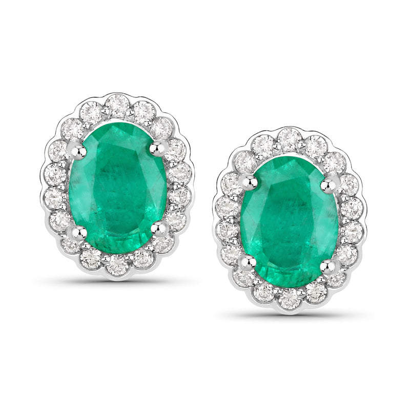 Scalloped oval emerald-green gemstone stud earrings in white gold with diamond halo, posts
