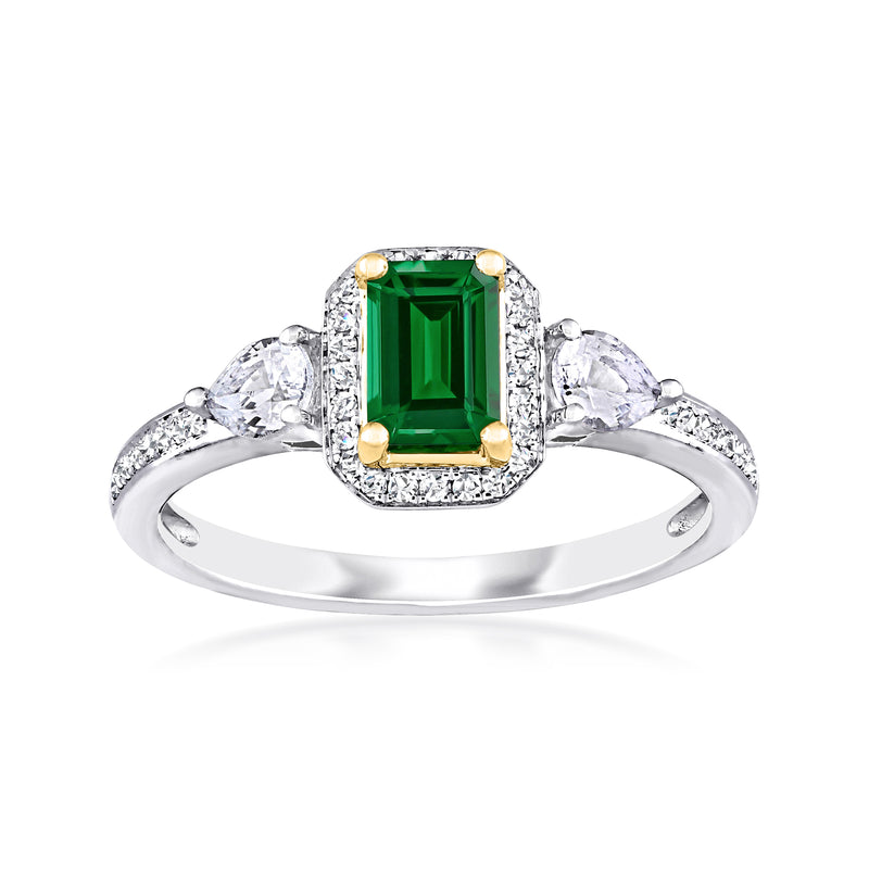 Two-tone gold ring with square emerald centerpiece, diamond halo, and side white stones.