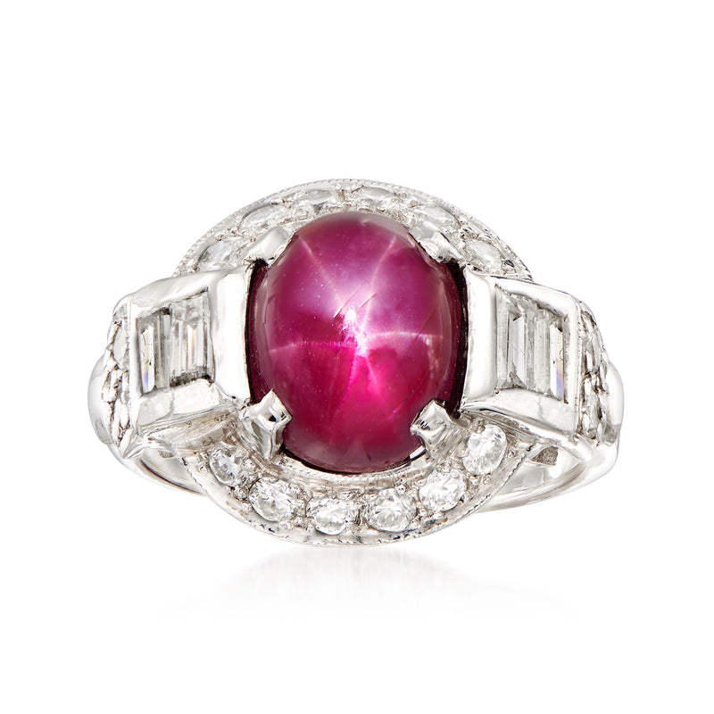 Platinum ring with oval star ruby center and baguette diamond side accents