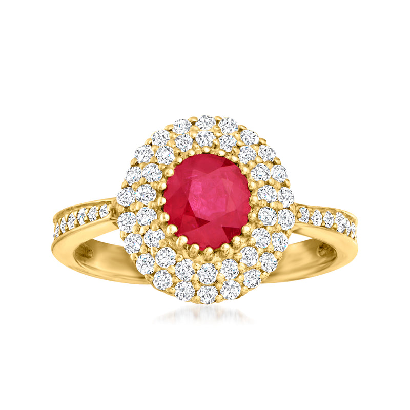 14kt yellow gold ring with oval red ruby center, diamond halo, and round diamond band