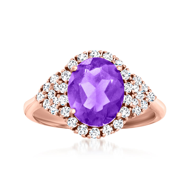 14kt rose gold ring with oval amethyst center and diamond halo, prong-set.