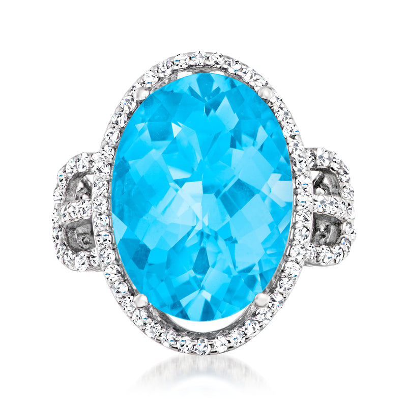 Oval Swiss blue topaz ring with diamond halo and split-shank 14kt white gold setting