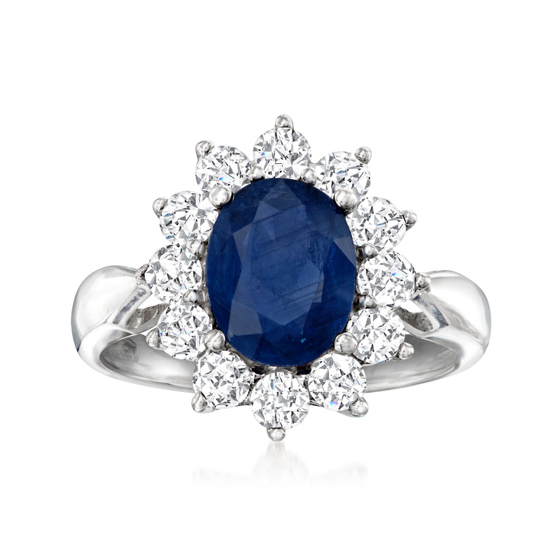 Blue sapphire center ring with diamond halo and 14k white gold band