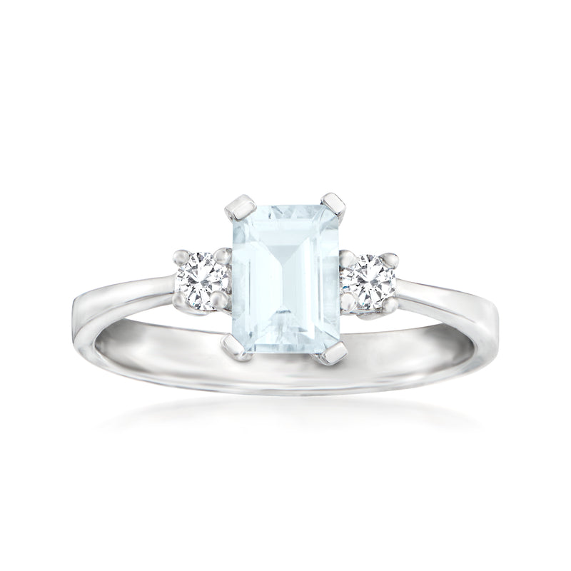14kt white gold ring with square aquamarine center, four prongs, diamond side stones