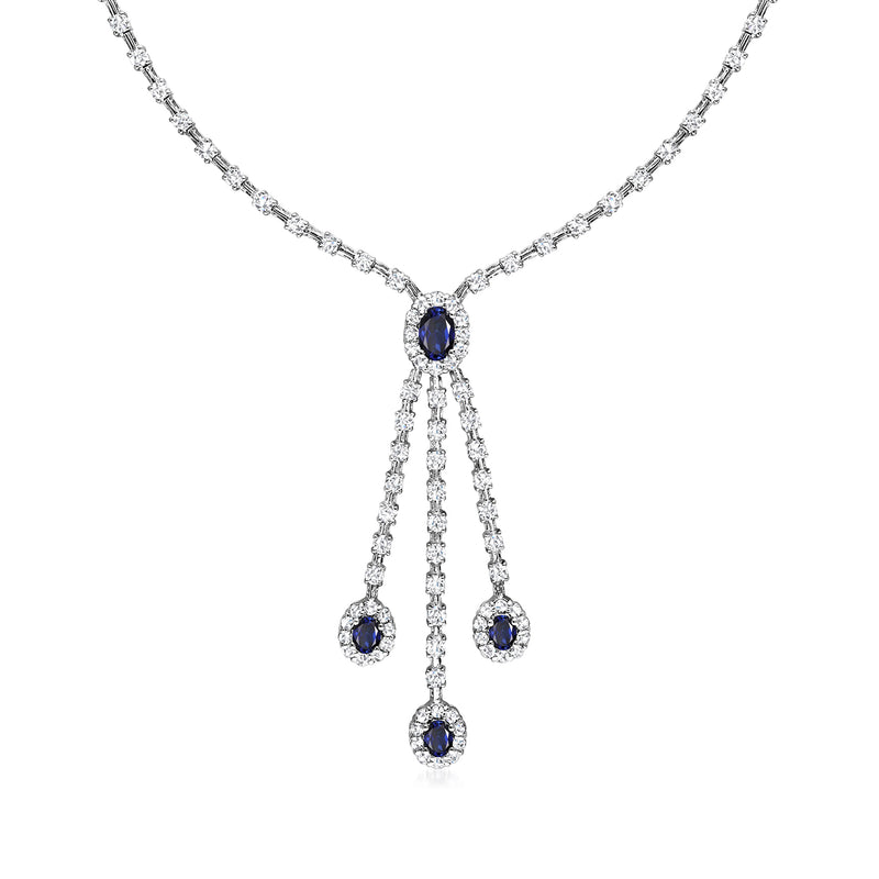 14kt white gold necklace with oval blue sapphire center and three dangling sapphire drops