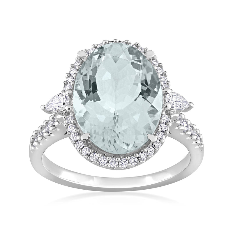 Oval aquamarine center halo diamond ring in 14kt white gold