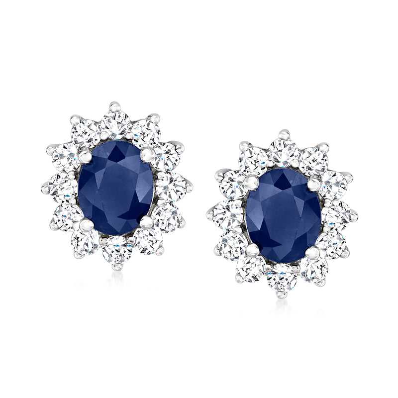 White gold sapphire and diamond halo stud earrings with oval blue center stones