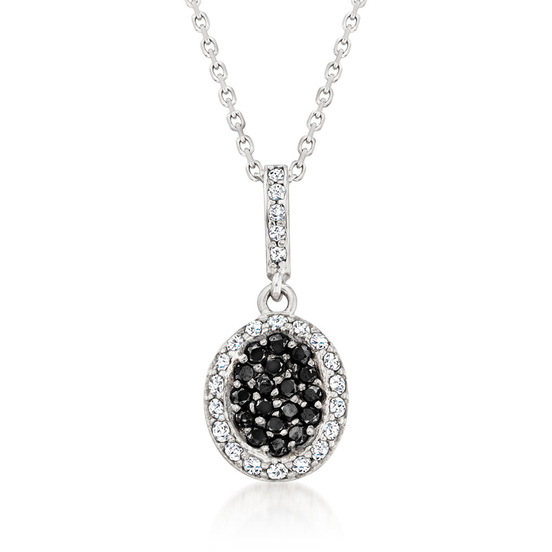White gold diamond pendant necklace with oval halo and black and white cluster center