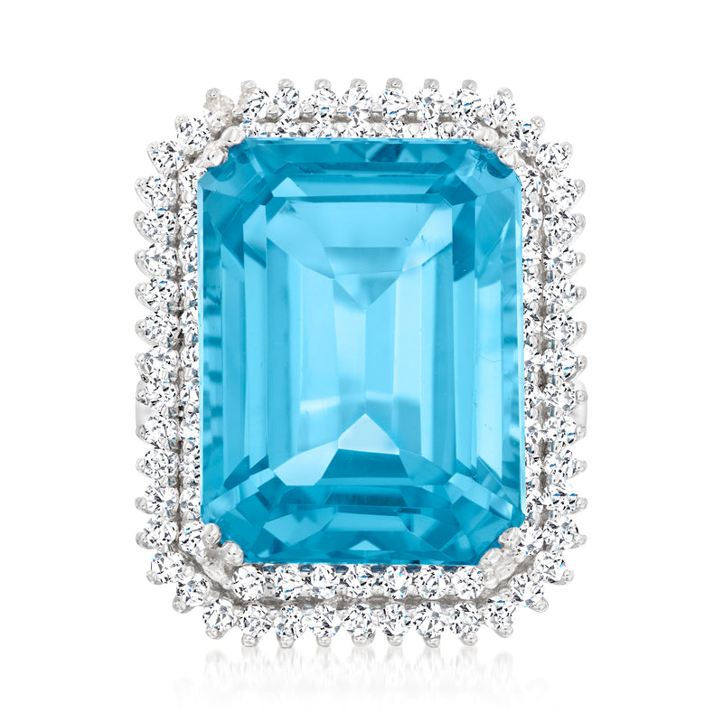14kt white gold ring with large blue topaz center and diamond halo