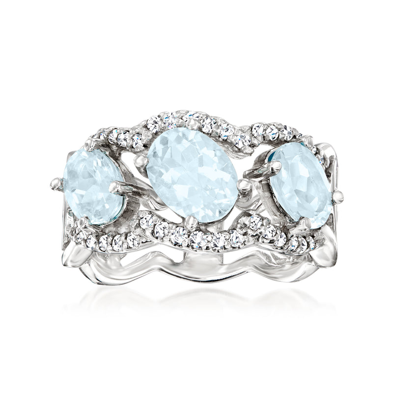 Aquamarine and diamond ring in 14kt white gold, oval center stone with side stones