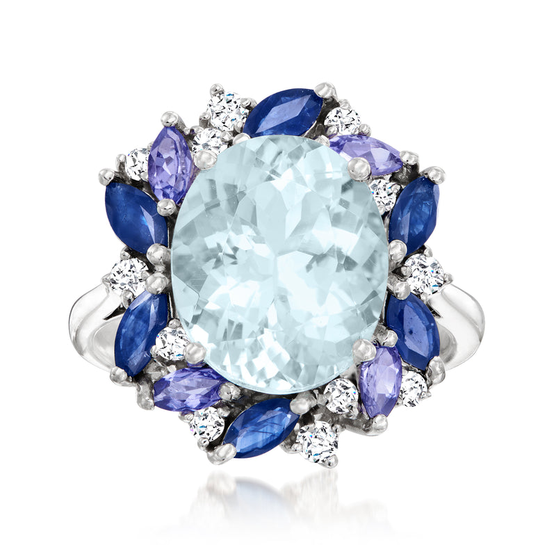 14kt white gold ring with large oval light-blue gemstone, blue side stones, and diamond accents