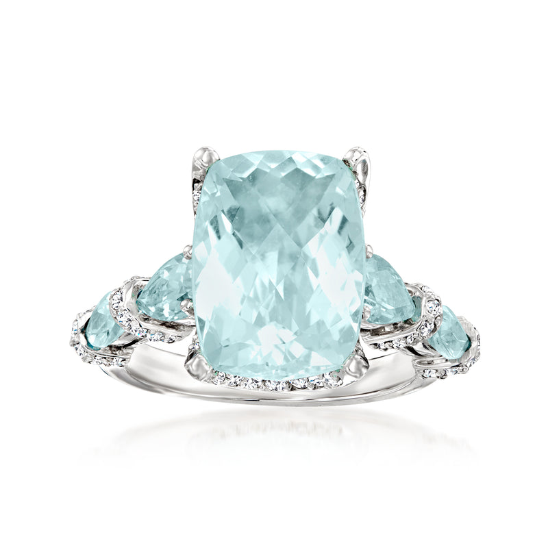 14kt white gold ring with large cushion-cut aquamarine center and diamond halo