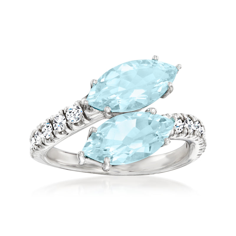 14kt white gold bypass ring with two oval aquamarine stones and small round diamonds