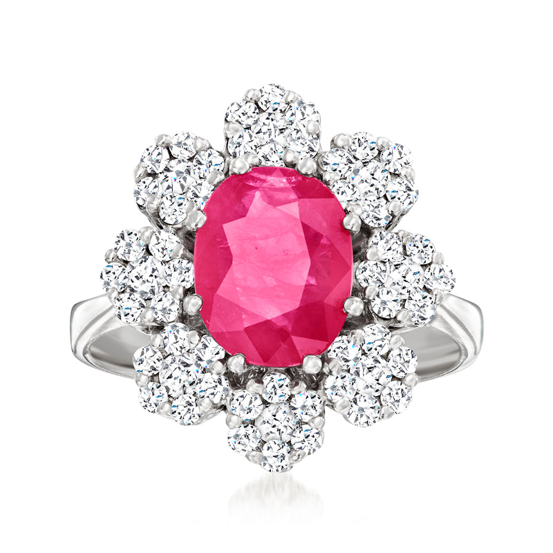 14kt white gold flower ring with oval pink ruby center and diamond halo petals
