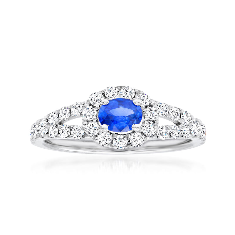 14kt white gold ring with oval blue sapphire center and round diamond halo