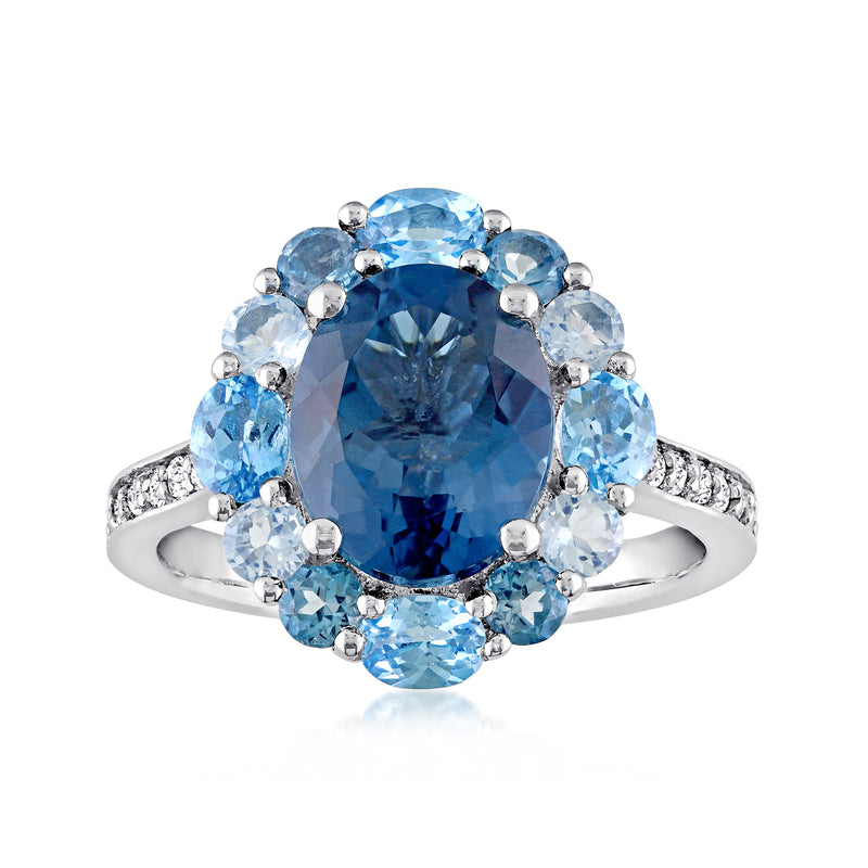 Sterling silver blue topaz halo ring with oval center and round white accents