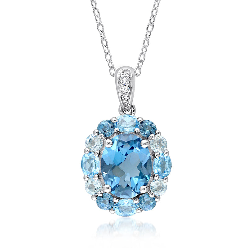 Sterling silver pendant necklace with oval blue topaz center and white accents